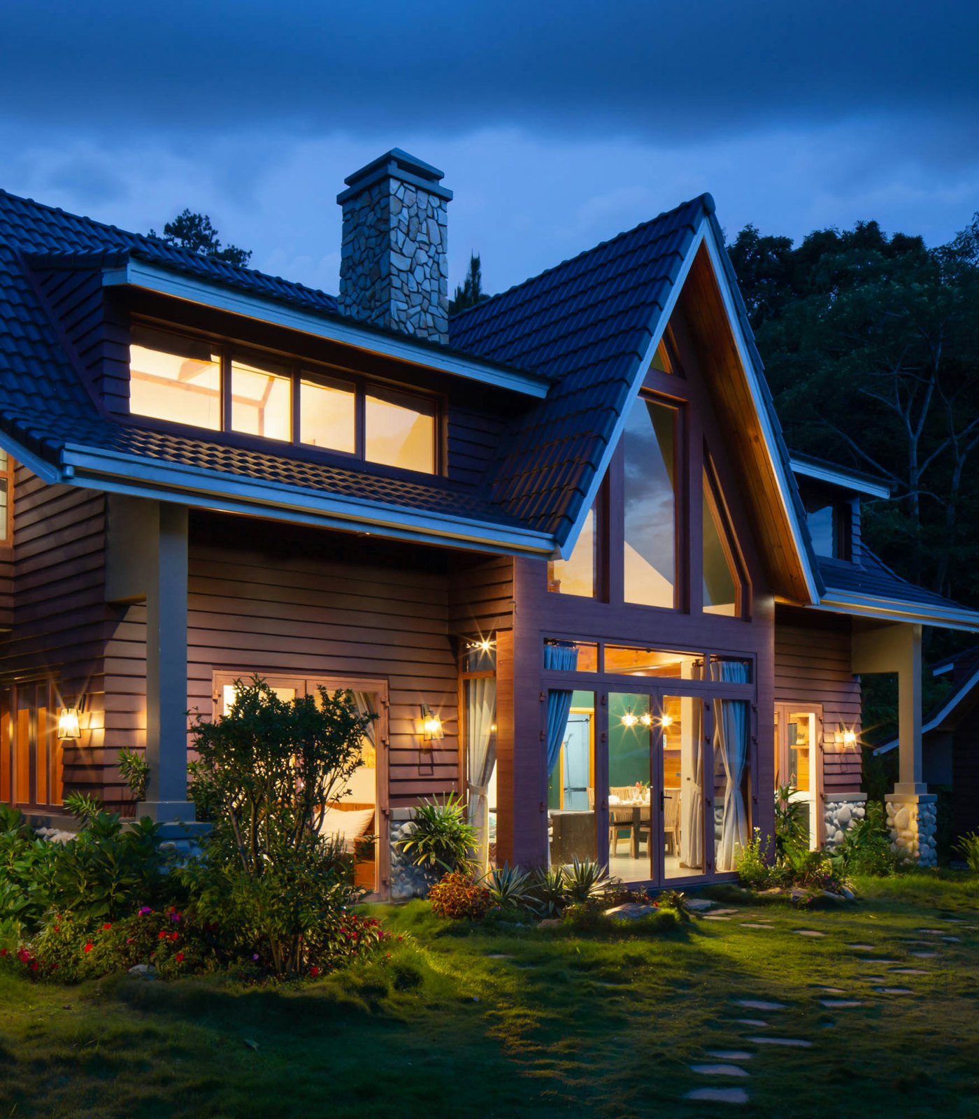 A warm, characterful family home lit up at dusk